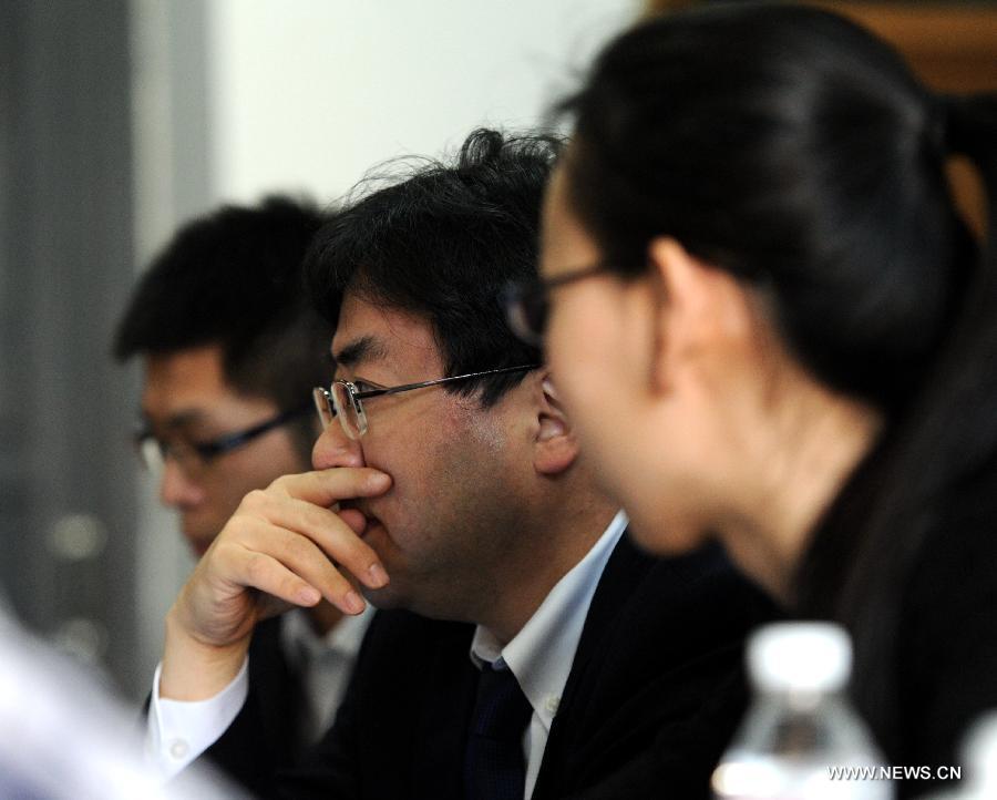 A Japanese lawyer (C) attends a hearing event for victims of Japanese abandoned chemical weapons in Harbin, capital of northeast China's Heilongjiang Province, April 29, 2014.
