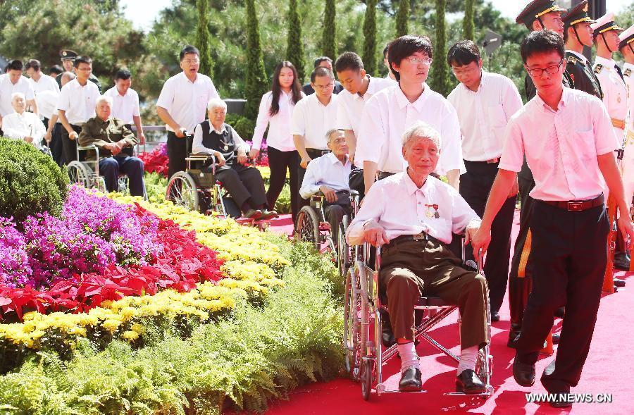 Veterans attend a ceremony to mark the 69th anniversary of the Victory Day in the Anti-Japanese War at the Museum of the War of the Chinese People's Resistance Against Japanese Aggression in Beijing, capital of China, Sept. 3, 2014.
