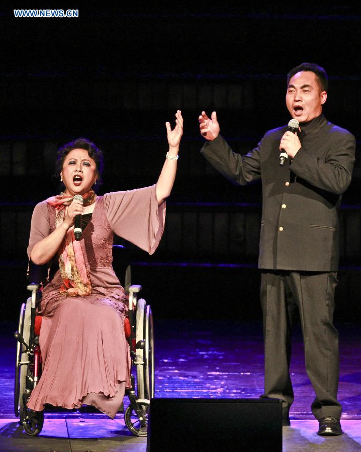 Performers sing during an evening concert to commemorate the 70th anniversary of the victory in the Chinese People's War of Resistance against Japanese Aggression and the victory of World's Anti-Fascist War, in town hall of Sydney, Australia, July 26, 2015.