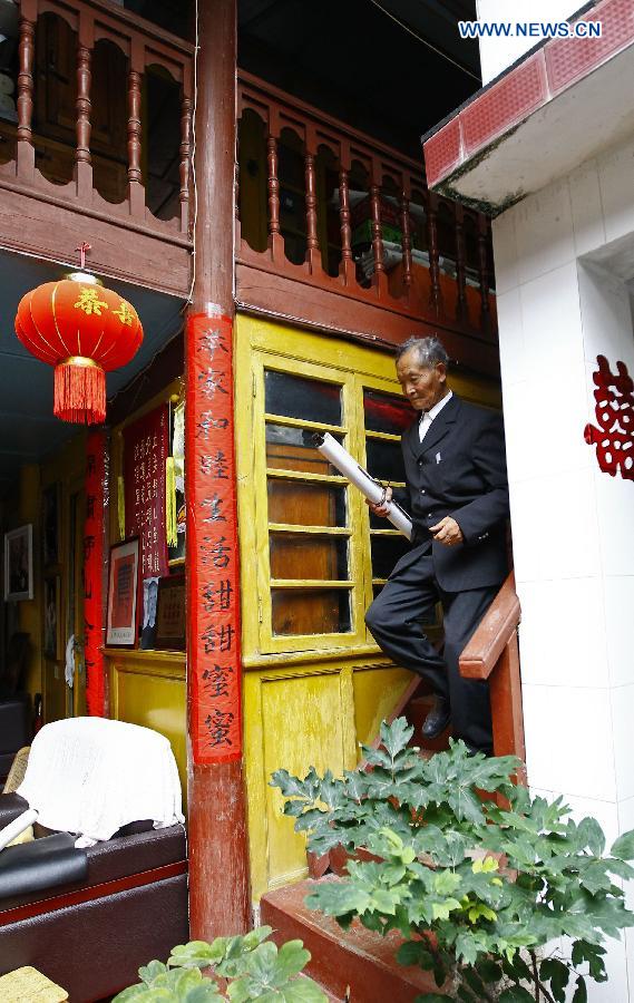 Lu Caiwen is seen at his home in Tengchong, southwest China's Yunnan Province, July 20, 2015. 