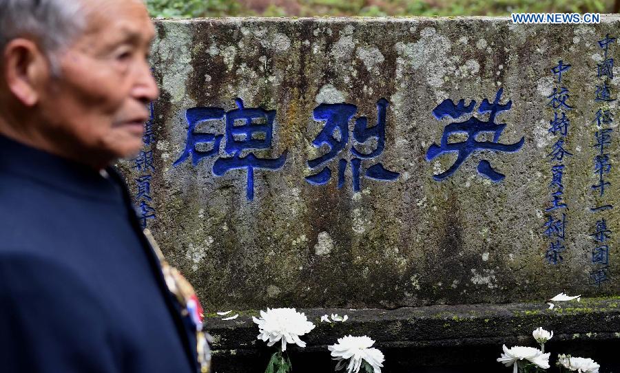 Lu Caiwen mourns for the soldiers sacrificed during the battle against Japan's invasion in Tengchong, southwest China's Yunnan Province, July 21, 2015.