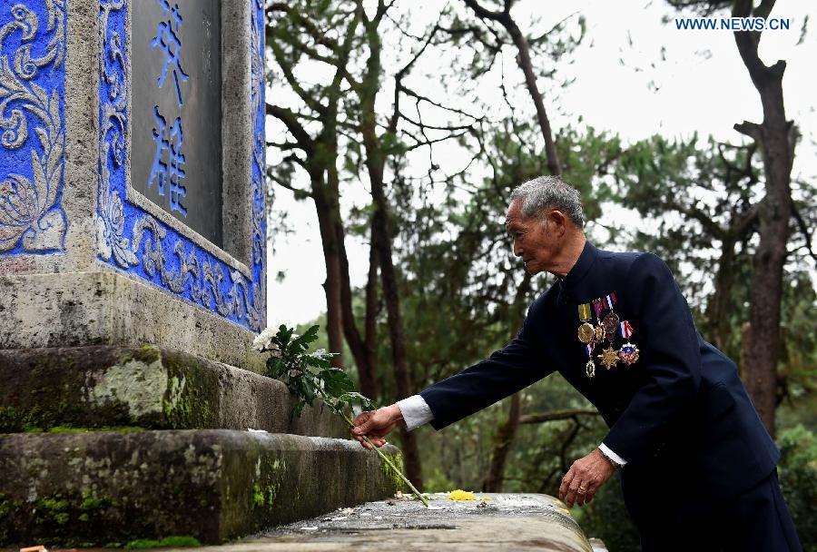 Lu Caiwen mourns for the soldiers sacrificed during the battle against Japan's invasion in Tengchong, southwest China's Yunnan Province, July 21, 2015.