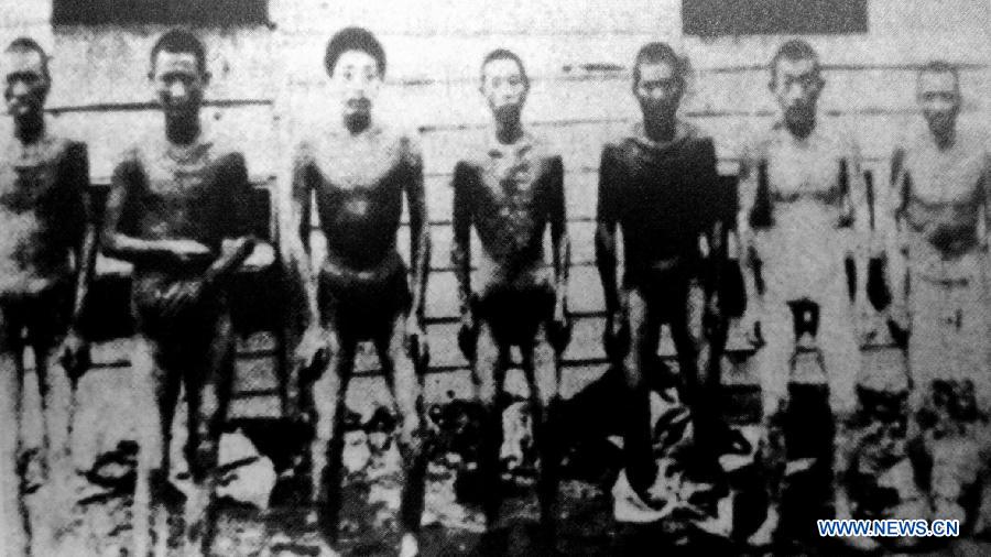 File photo copy shows Chinese forced labors in Hanaoka, Japan. Japan invaded northeast China in 1931 and conducted a full-scale invasion in 1937. By the end of World War II, millions of Chinese forced laborers had been enslaved by Japanese invaders to toil under harsh conditions at mines and factories in northeast China and Japan. Those laborers were under close watch and suffered inhumane treatment. Many of them died from malnutrition, illness, physical abuse and plain murder. (Xinhua) 