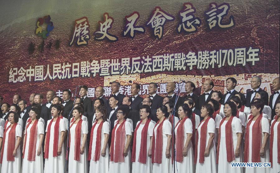 Members of a chorus perform during a gala held to mark the 70th anniversary of the victory of the Chinese people's war against Japanese aggression and the world's anti-Fascist war, in Hong Kong, south China, Aug. 12, 2015.