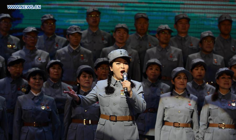Performers sing 'The Song of the New Fourth Army' at a concert in Luanping County of Chengde City, north China's Hebei Province, Aug. 13, 2015. 