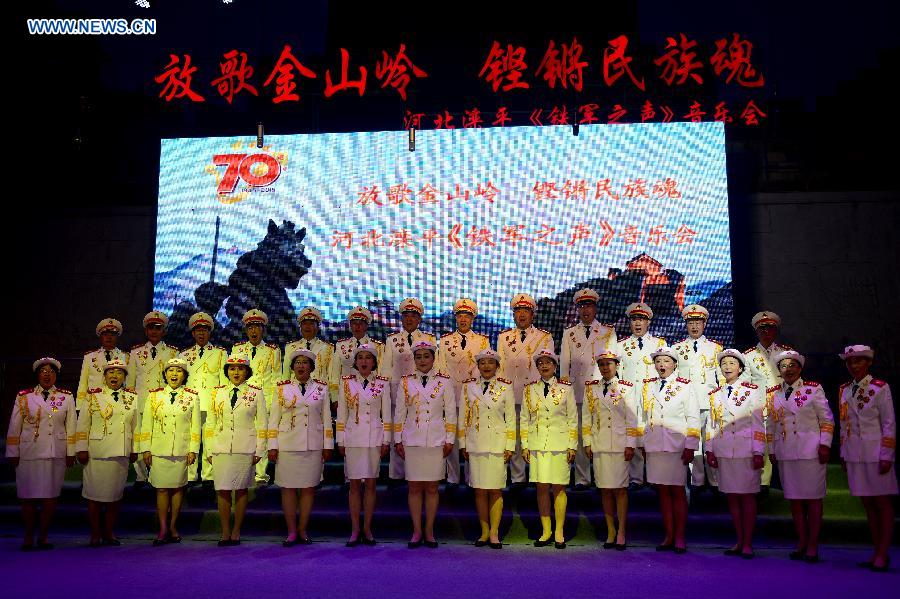 Performers sing 'On the Taihang Mountain' at a concert in Luanping County of Chengde City, north China's Hebei Province, Aug. 13, 2015.