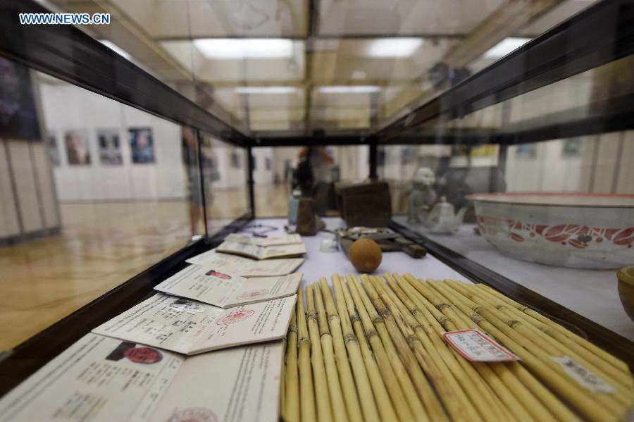 Daily objects of comfort women survivors are seen in an exhibition of photos and real objects at the Hangzhou Library in Hangzhou, capital of east China's Zhejiang Province, Aug. 18, 2015. 