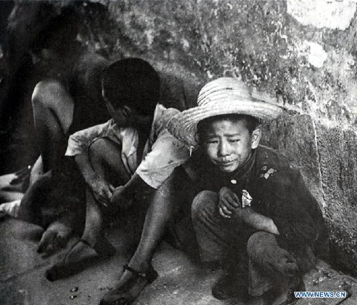 Undated file photo shows Chinese waifs whose parents were killed by Japanese soldiers in China. In the wartime of Japanese aggression to China during World War II, around 2.2 million Chinese children were killed or injured by Japanese invaders. 
