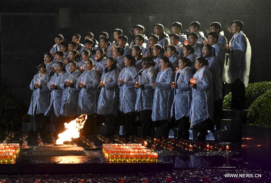 Photo taken on Dec. 13, 2016 shows the scene of a candlelight vigil for China's National Memorial Day for Nanjing Massacre Victims at the memorial hall for the massacre victims in Nanjing, east China's Jiangsu Province. (Xinhua/Sun Can)