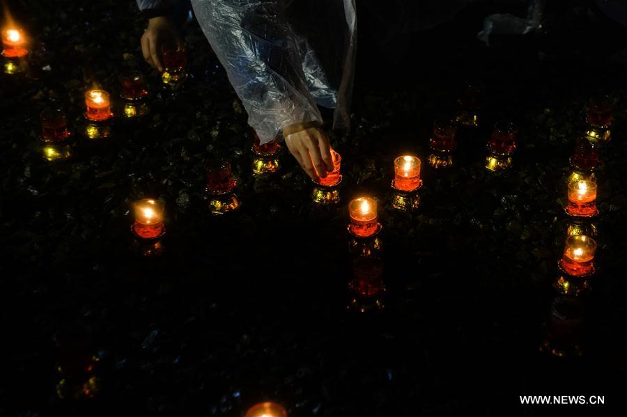 Photo taken on Dec. 13, 2016 shows the scene of a candlelight vigil for China's National Memorial Day for Nanjing Massacre Victims at the memorial hall for the massacre victims in Nanjing, east China's Jiangsu Province. (Xinhua/Sun Can)