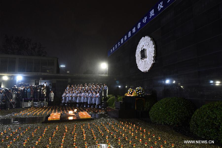 Photo taken on Dec. 13, 2016 shows the scene of a candlelight vigil for China's National Memorial Day for Nanjing Massacre Victims at the memorial hall for the massacre victims in Nanjing, east China's Jiangsu Province. (Xinhua/Sun Can)