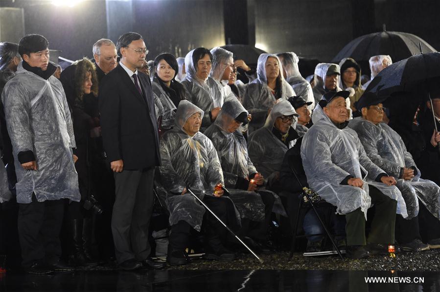 Photo taken on Dec. 13, 2016 shows the scene of a candlelight vigil for China's National Memorial Day for Nanjing Massacre Victims at the memorial hall for the massacre victims in Nanjing, east China's Jiangsu Province. (Xinhua/Sun Can)