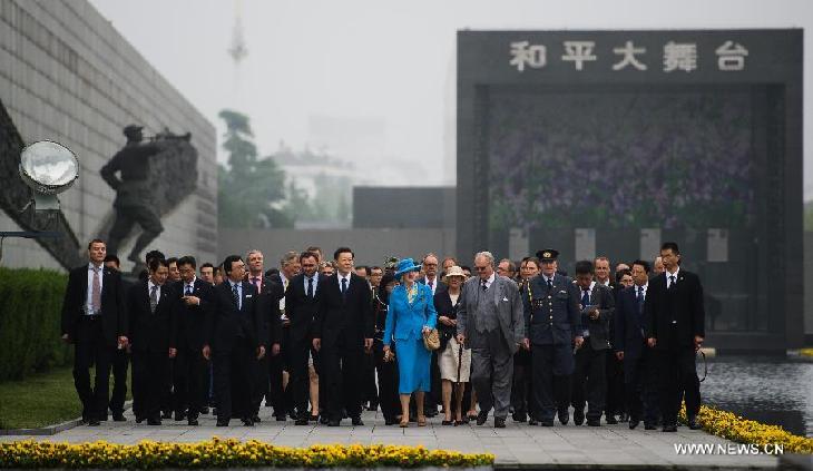 Queen of Denmark Margrethe II visits the Memorial Hall of the Victims in Nanjing Massacre by Japanese Invaders, in Nanjing, capital of east China's Jiangsu Province, April 27, 2014. 