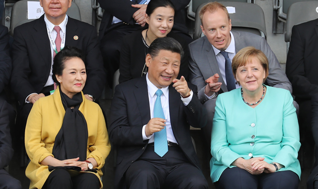 Xi, Merkel watch friendly football match between Chinese, German youth teams