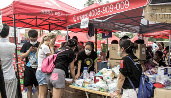 Volunteers seen at Taida Hospital near warehouse explosion site in Tianjin